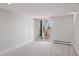Carpeted bedroom with lots of natural light from the sliding doors leading to the balcony at 740 N Pearl St # 606, Denver, CO 80203