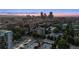 Overhead dusk view capturing the city skyline with surrounding residential areas at 740 N Pearl St # 606, Denver, CO 80203