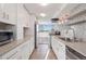 Bright kitchen with neutral countertops, stainless steel appliances, and lots of natural light at 740 N Pearl St # 606, Denver, CO 80203