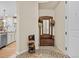 Inviting entryway with wood bench, mirror, and charming decor at 2198 Primo Rd # 103, Highlands Ranch, CO 80129