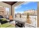 Covered patio overlooking a snow-dusted landscape at 2198 Primo Rd # 103, Highlands Ranch, CO 80129