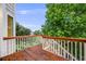 Wooden back deck with white railings offering views of the surrounding neighborhood at 22428 Quail Run Ln, Parker, CO 80138