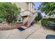 Outdoor patio space with a table set and stairs leading to the upper deck at 22428 Quail Run Ln, Parker, CO 80138
