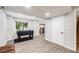 Finished basement with modern flooring, foosball table, and ample space for recreation at 22428 Quail Run Ln, Parker, CO 80138