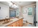 Bright bathroom with double sinks, vanity, and separate shower and tub at 22428 Quail Run Ln, Parker, CO 80138