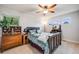 Comfortable bedroom with a ceiling fan, classic furniture, and natural light at 22428 Quail Run Ln, Parker, CO 80138