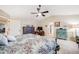 Bedroom with vaulted ceiling, patterned bedding, and comfortable furnishings at 22428 Quail Run Ln, Parker, CO 80138