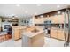Spacious kitchen with stainless appliances, granite countertops, and eat-in kitchen island at 22428 Quail Run Ln, Parker, CO 80138