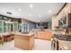 Open kitchen and dining area with granite countertops, stainless appliances, and a breakfast nook at 22428 Quail Run Ln, Parker, CO 80138