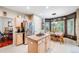 Open kitchen and dining area featuring granite countertops and stainless steel appliances at 22428 Quail Run Ln, Parker, CO 80138