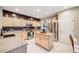 Bright kitchen features stainless appliances, a central island, and granite countertops at 22428 Quail Run Ln, Parker, CO 80138