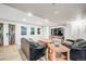 Spacious living room with ample natural light, comfortable seating, and a television at 22428 Quail Run Ln, Parker, CO 80138