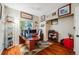 Well-lit home office with wood floors, a built-in desk, and ample storage space at 22428 Quail Run Ln, Parker, CO 80138