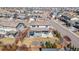 Aerial view of a home with a well-maintained backyard, covered patio, and a basketball court at 14100 Blue Wing Ln, Parker, CO 80134