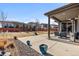 Large backyard features a covered patio, basketball hoop, and ample space for outdoor enjoyment at 14100 Blue Wing Ln, Parker, CO 80134