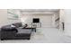 Basement features a large gray sofa and a neutral-colored rug at 14100 Blue Wing Ln, Parker, CO 80134