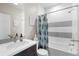 Well-lit bathroom features modern fixtures, a combined tub and shower, and stylish decor at 14100 Blue Wing Ln, Parker, CO 80134
