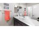 Stylish bathroom with a bright countertop and sleek fixtures and a spacious mirror at 14100 Blue Wing Ln, Parker, CO 80134