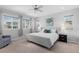 Serene bedroom with natural light, large windows, and a comfortable seating area at 14100 Blue Wing Ln, Parker, CO 80134