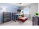 Fun bedroom with a unique bunk bed design, dresser, and lots of space for play at 14100 Blue Wing Ln, Parker, CO 80134