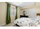 Cozy bedroom with green curtains and a black dresser at 14100 Blue Wing Ln, Parker, CO 80134