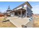 This home offers a private backyard with a covered patio, seating, and recreational area at 14100 Blue Wing Ln, Parker, CO 80134