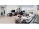 Spacious living room features contemporary furnishings, large windows, and ample natural light at 14100 Blue Wing Ln, Parker, CO 80134