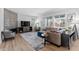 Comfortable living room with a stone fireplace, stylish decor, and lots of natural light at 14100 Blue Wing Ln, Parker, CO 80134
