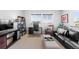 Bright living room features a dedicated workspace with a modern desk and comfortable seating area at 14100 Blue Wing Ln, Parker, CO 80134
