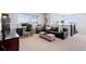 Upstairs living room with a desk, comfortable seating, and bright natural light at 14100 Blue Wing Ln, Parker, CO 80134
