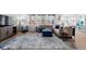 Spacious living room with large windows, a comfortable sectional sofa, and stylish decor at 14100 Blue Wing Ln, Parker, CO 80134