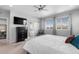 Large bedroom with a TV and a private bathroom with a shower and tub at 14100 Blue Wing Ln, Parker, CO 80134