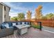 Spacious back deck with comfortable outdoor seating and a fire pit, perfect for entertaining guests at 6893 Decatur St, Denver, CO 80221