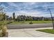 View of a community park, including a playground, seating areas, and well-maintained landscaping at 6893 Decatur St, Denver, CO 80221