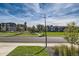 Community park featuring a playground and manicured green spaces surrounded by homes at 6893 Decatur St, Denver, CO 80221