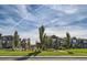 Community park view of a playground, seating areas, and well-maintained landscaping at 6893 Decatur St, Denver, CO 80221