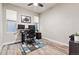 Functional home office with dual monitors, a comfortable chair, and ample natural light at 6893 Decatur St, Denver, CO 80221