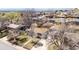 Charming single-story home with a well-maintained lawn and mature trees in a quiet neighborhood at 7977 Durango St, Denver, CO 80221