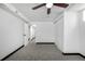 Bedroom featuring neutral carpet, white walls, a ceiling fan and closet, ready for personalization at 7977 Durango St, Denver, CO 80221