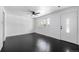 Bright living room showcasing hardwood floors, a large window, and fresh paint at 7977 Durango St, Denver, CO 80221