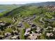Picturesque aerial view of luxury homes surrounded by natural beauty, and stunning mountain views at 6268 Dakota Ridge Dr, Littleton, CO 80125
