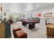 Spacious basement area featuring a pool table, bar area, and ample seating at 6268 Dakota Ridge Dr, Littleton, CO 80125