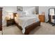 Warm bedroom with wooden furniture, soft lighting, and cozy decor at 6268 Dakota Ridge Dr, Littleton, CO 80125