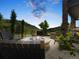 Outdoor fire pit with seating overlooking scenic views of the surrounding landscape and sunset at 6268 Dakota Ridge Dr, Littleton, CO 80125