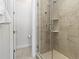 Modern shower with glass enclosure, sleek fixtures, built-in shelves and neutral tile at 6268 Dakota Ridge Dr, Littleton, CO 80125