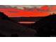 Gorgeous sunset reflecting on the lake at 6268 Dakota Ridge Dr, Littleton, CO 80125