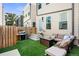 Charming backyard with artificial turf, fire pit, lounge seating, and a barbecue grill at 1250 W Osceola St # 2, Denver, CO 80204