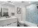 Modern bathroom featuring a glass-enclosed shower, sleek vanity, and contemporary fixtures at 1250 W Osceola St # 2, Denver, CO 80204