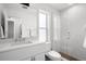 Clean, bright bathroom featuring a glass shower and modern fixtures at 1250 W Osceola St # 2, Denver, CO 80204