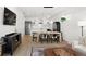 Open-concept dining and living area with hardwood floors and modern decor at 1250 W Osceola St # 2, Denver, CO 80204
